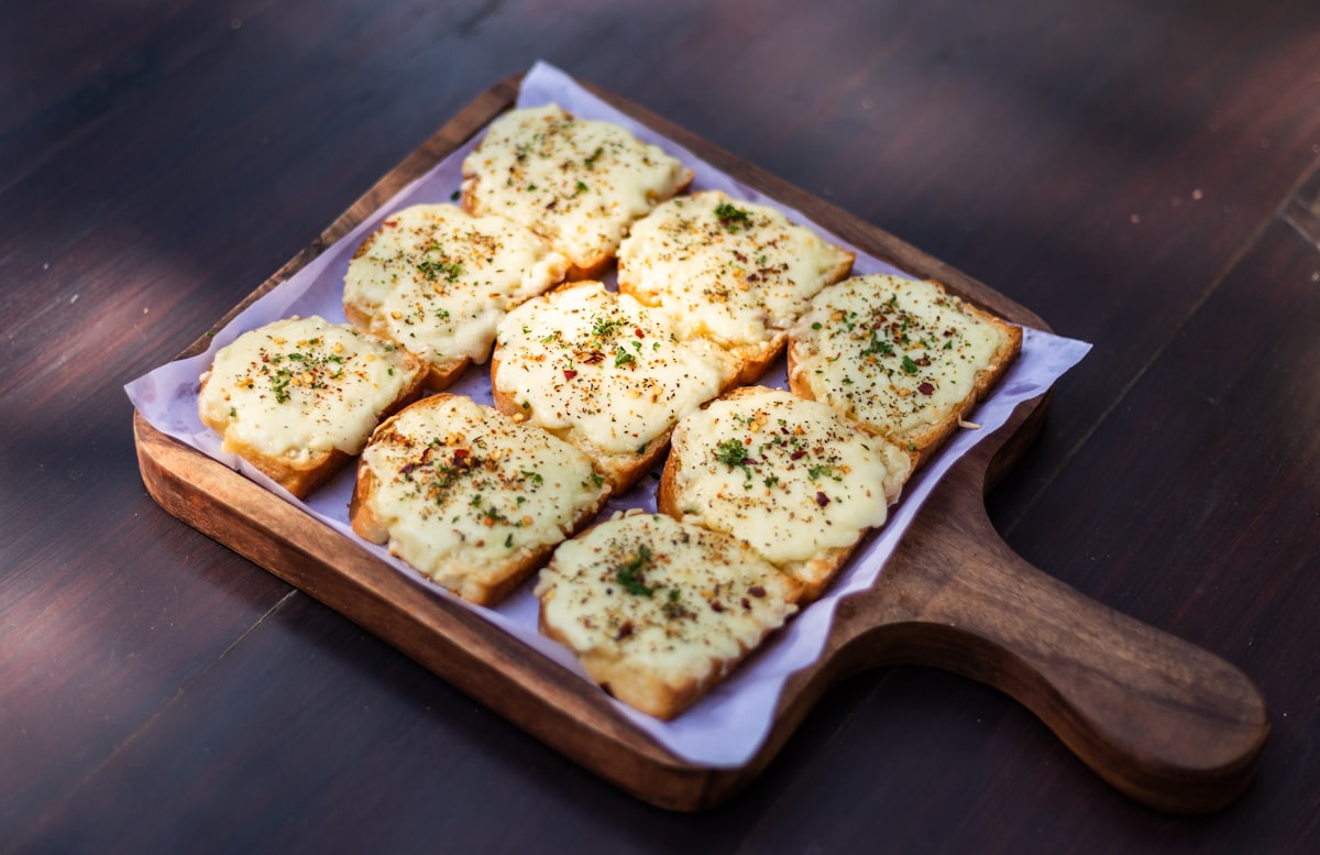 Wood-oven garlic bread topped with melted Italian mozzarella